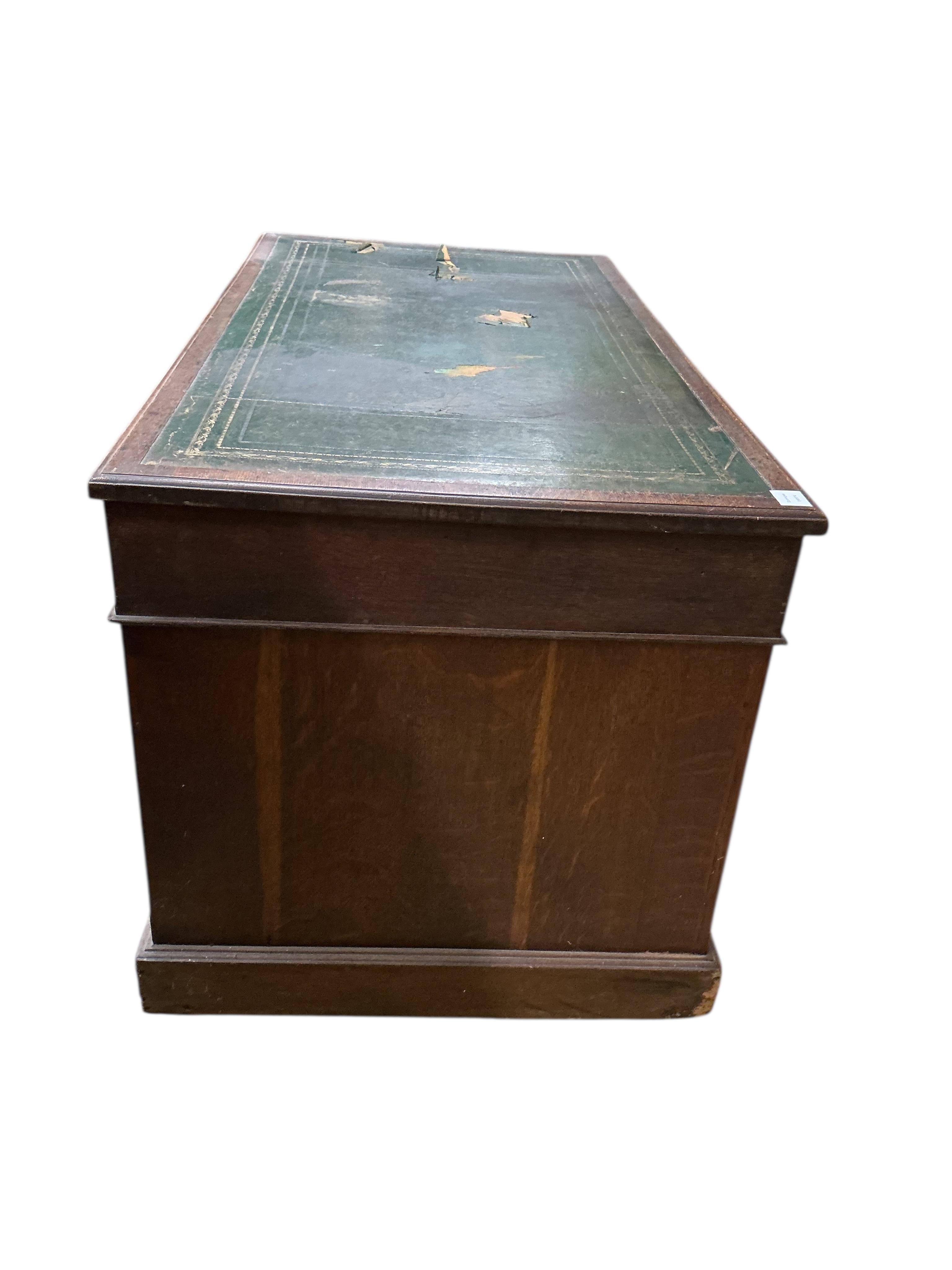 A Victorian oak pedestal desk, width 136cm, depth 72cm, height 75cm